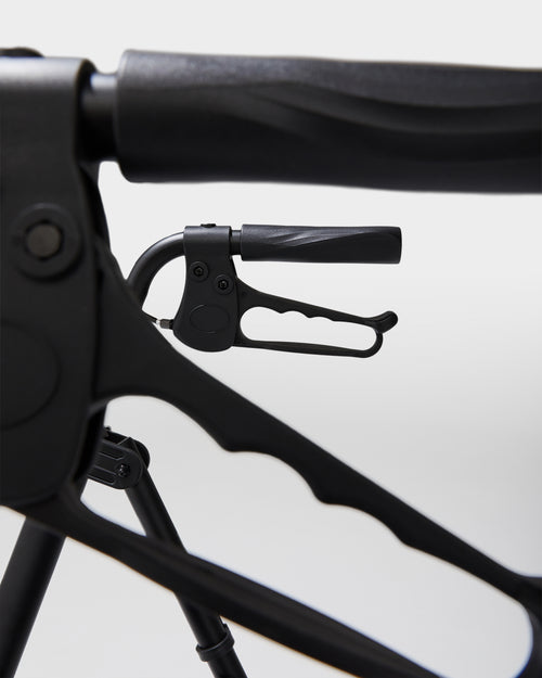 Close-up of a black bicycle handlebar with a white background