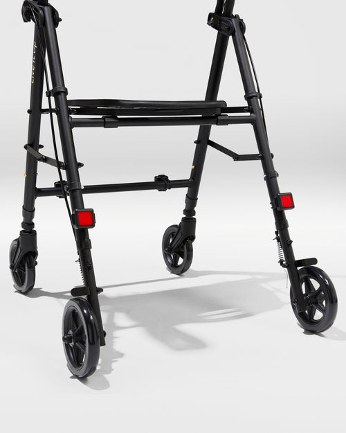 Black walker with wheels on a white background