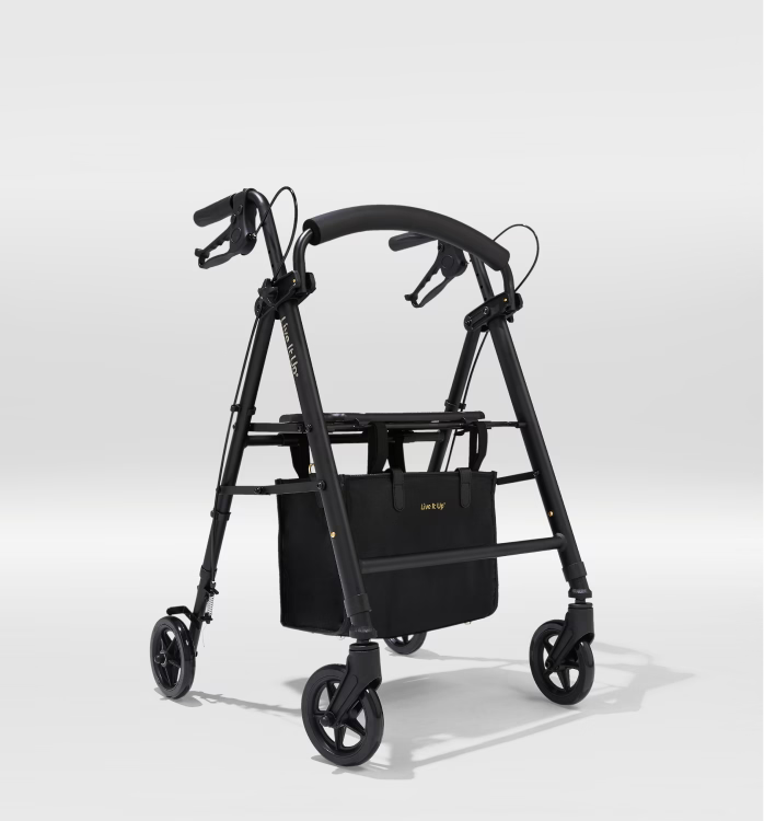 Black walker with a basket on a white background