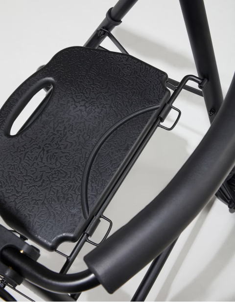 Close-up of a black bicycle seat and frame on a white background