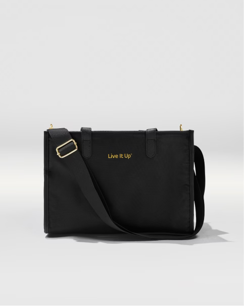Black shoulder bag with 'Live It Up' text on a light gray background