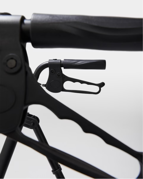 Close-up of a black bicycle handlebar with a white background