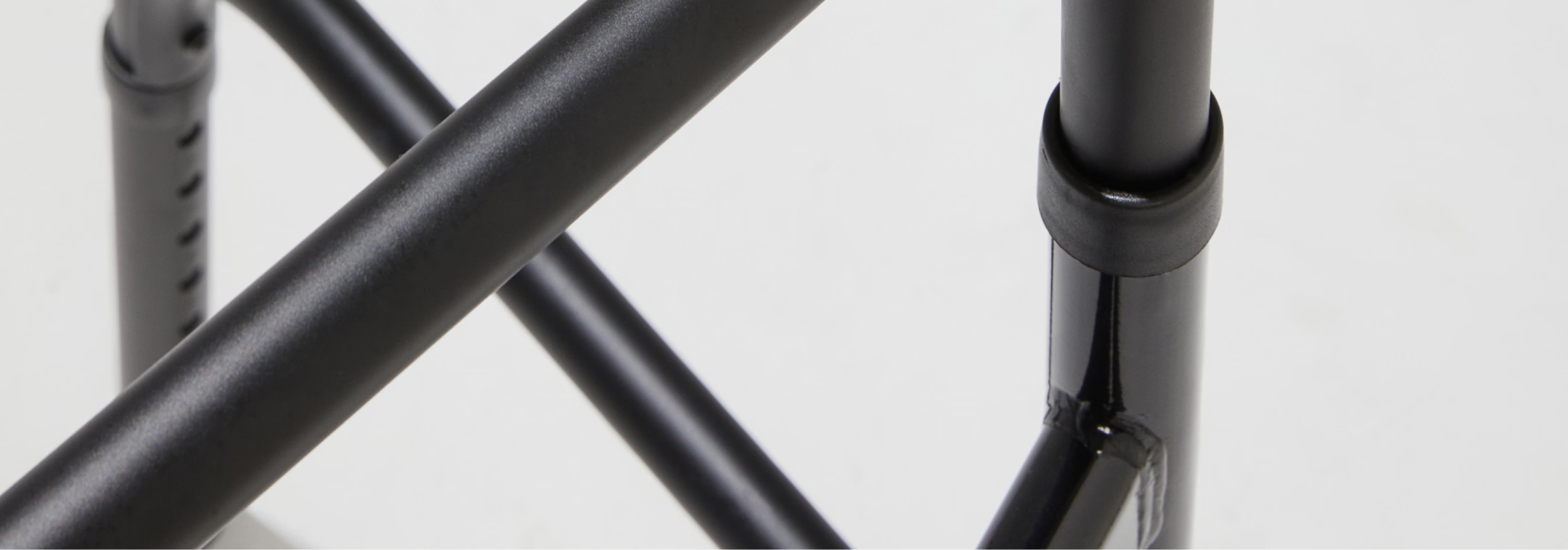 Close-up of a black metal frame on a white background