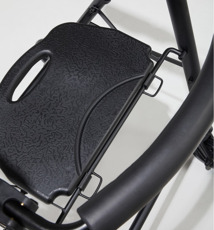 Close-up of a black bicycle seat on a white background