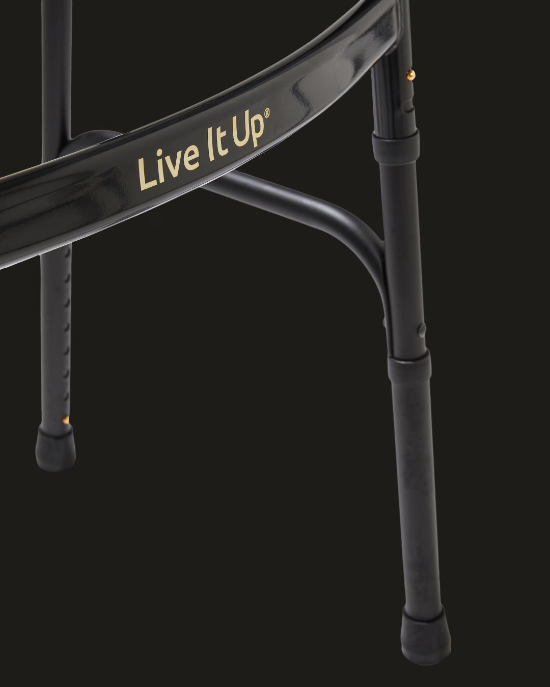 Black metal stand with 'Live It Up' branding on a black background