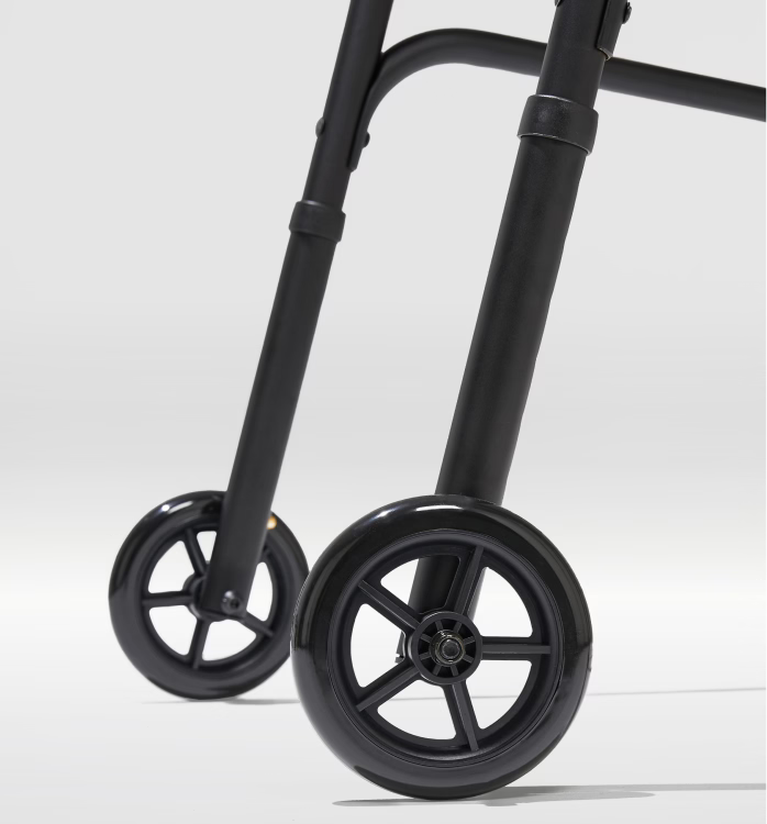 Close-up of a black walker with wheels on a white background