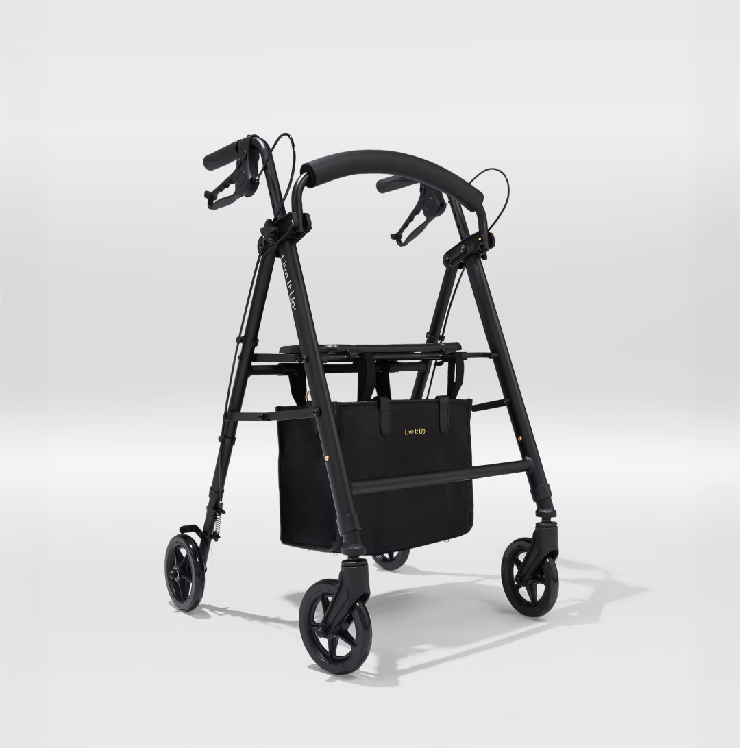 Black walker with a bag attached on a white background